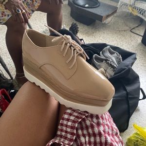 Beige high platform dress shoes